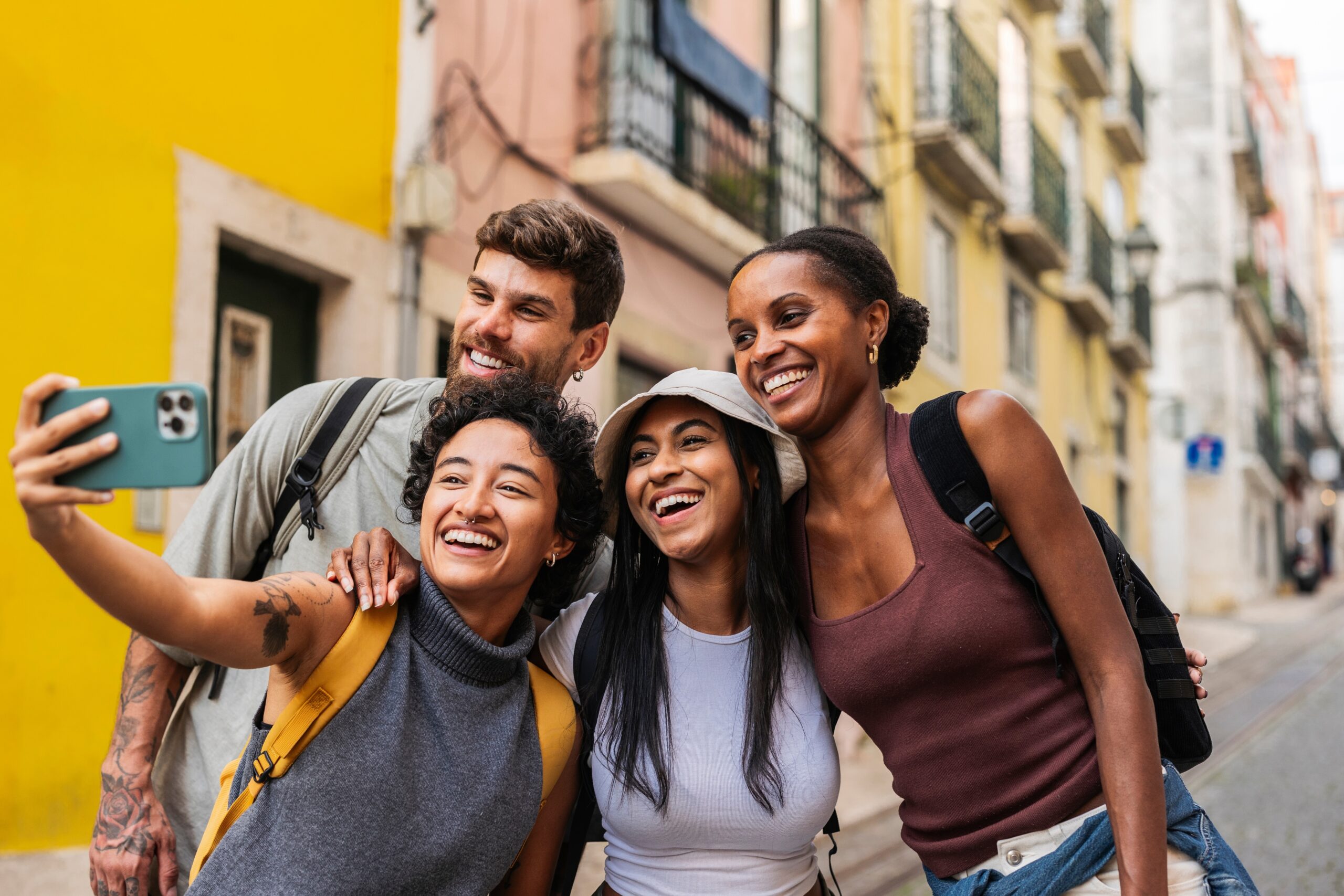 Group,Of,Multi,Ethnic,Friends,Smiling,And,Capturing,A,Selfie